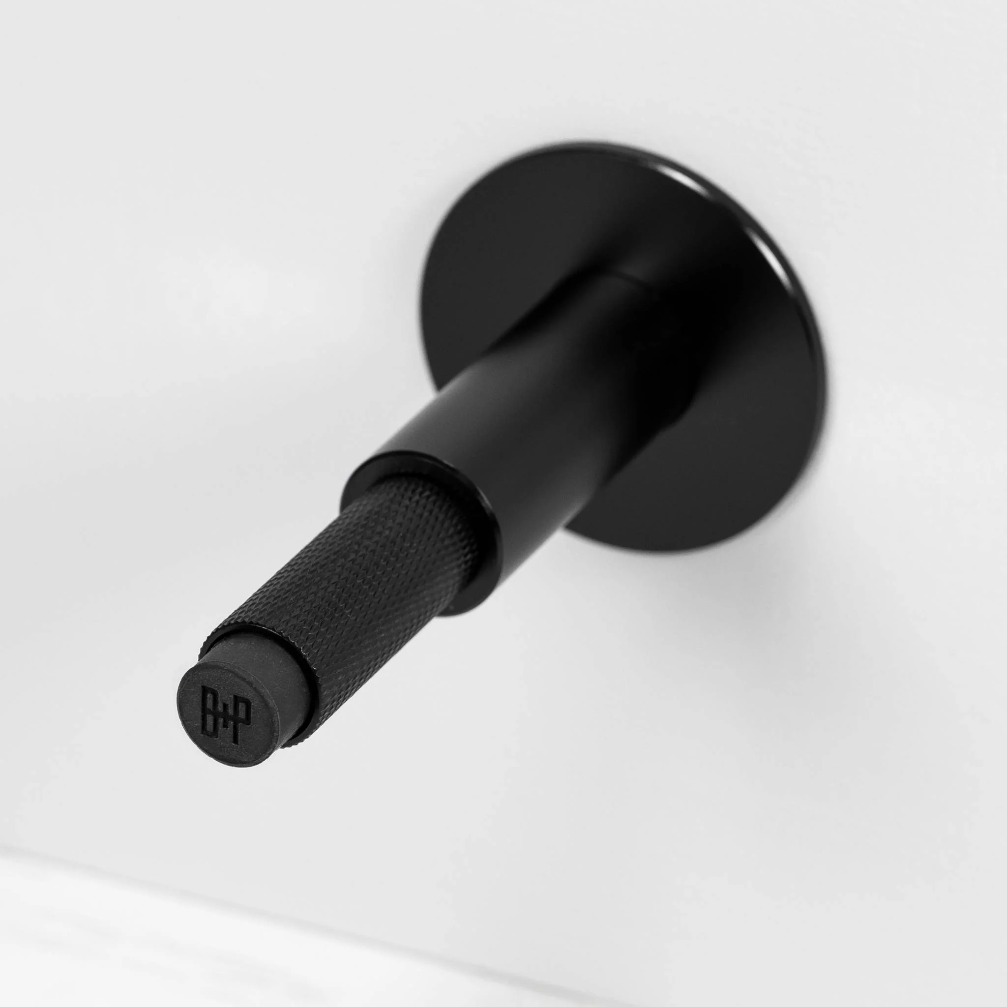 Wall Mounted Door Stop in Solid Metal with Cross Knurl Pattern