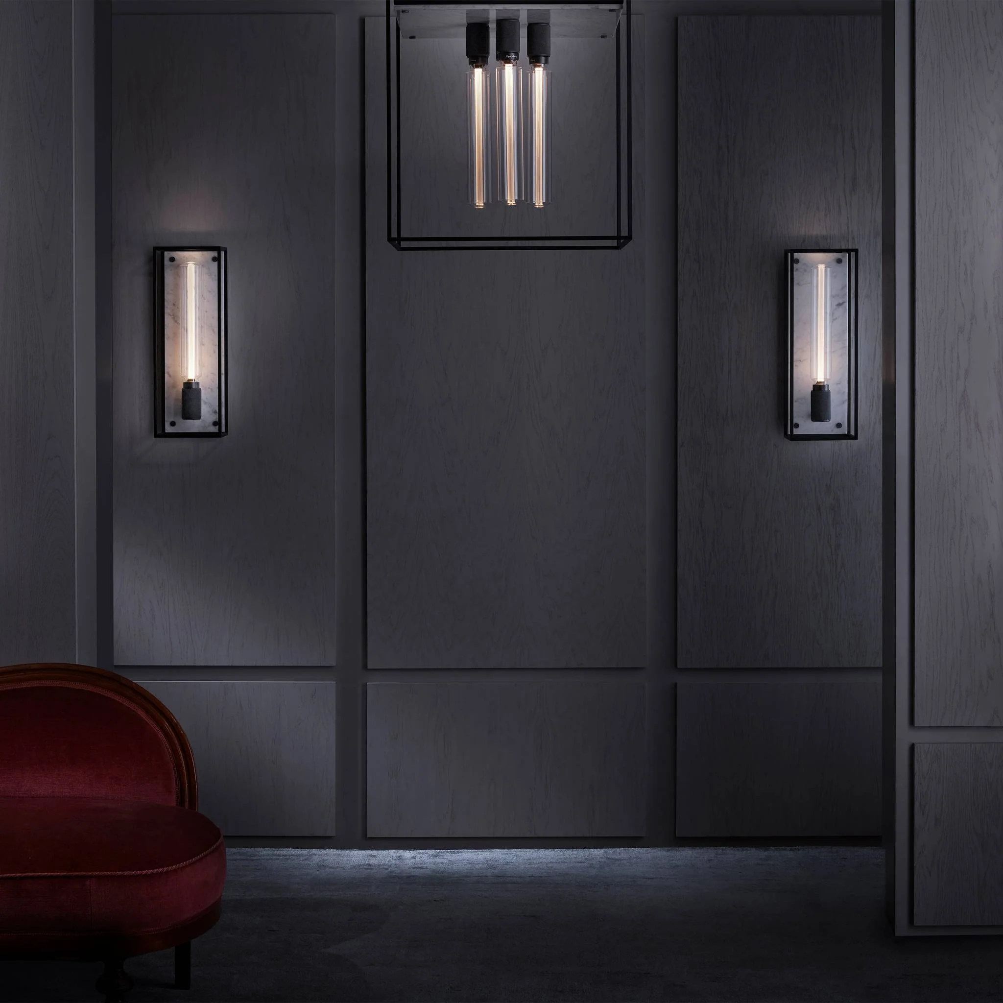 Caged Wall Large Matte Black Wall Light Frames the Buster Bulb