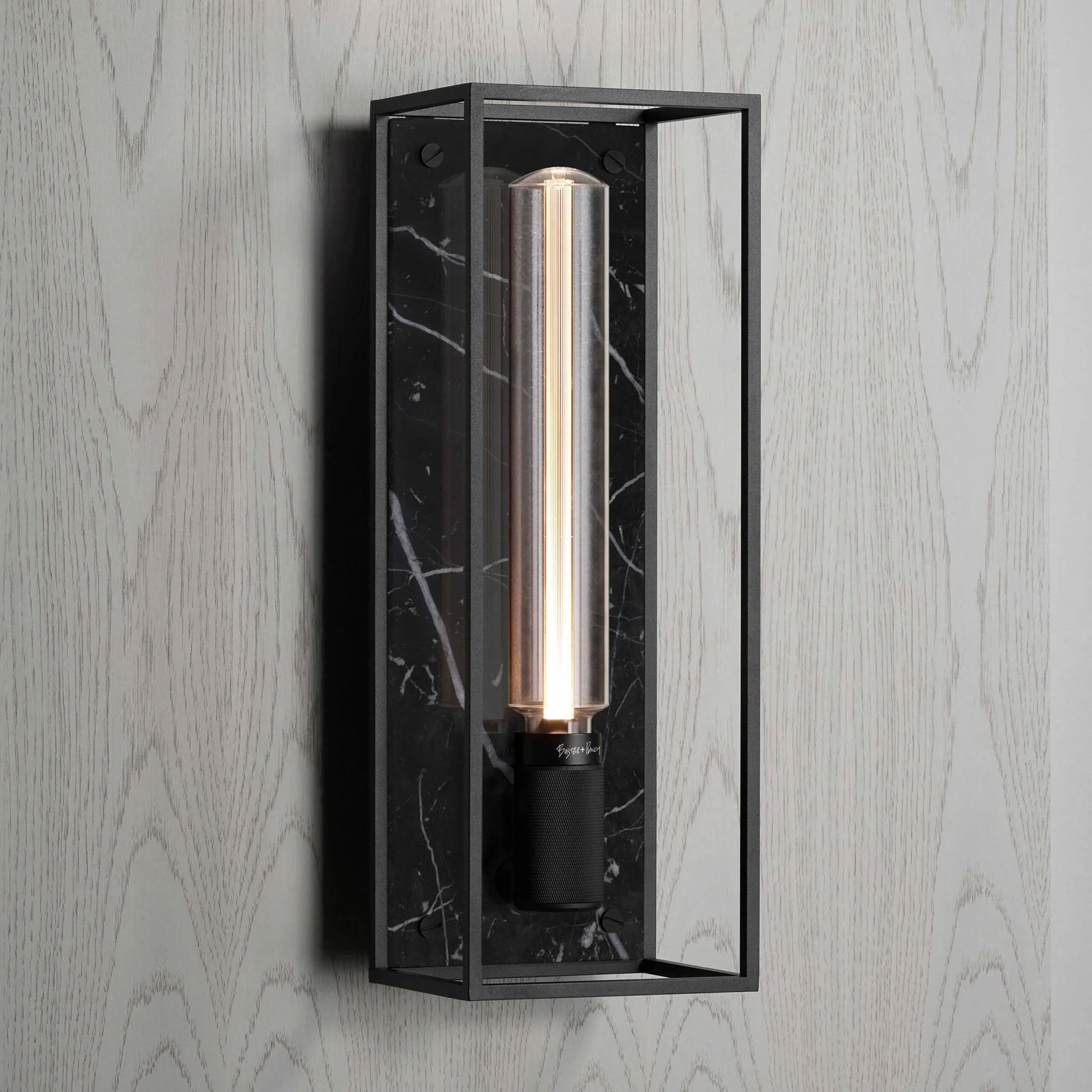 Caged Wall Large Matte Black Wall Light Frames the Buster Bulb