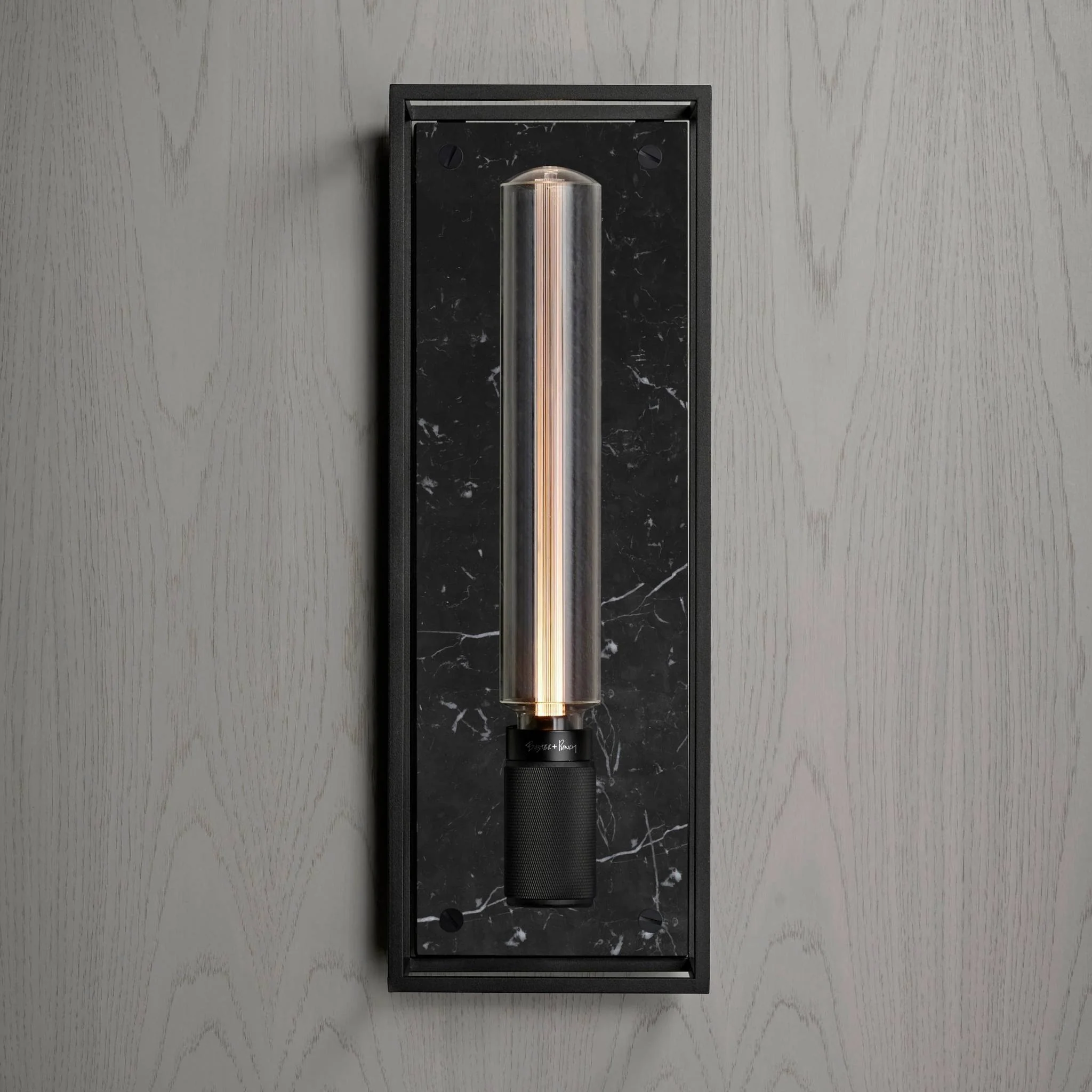 Caged Wall Large Matte Black Wall Light Frames the Buster Bulb
